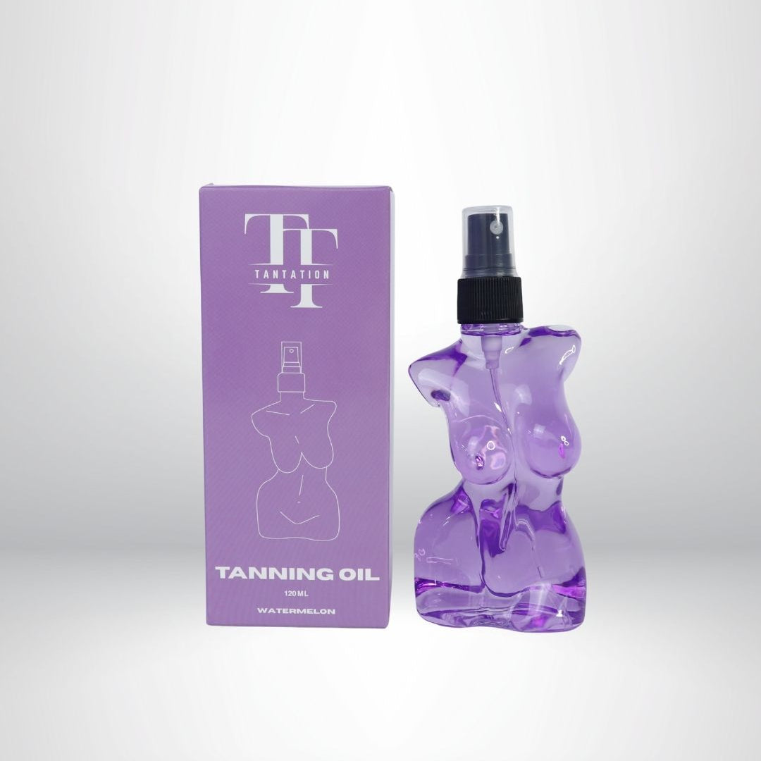 Purple tanning oil bottle and packaging on a white background